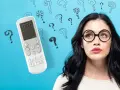 Ragazza con occhiali guarda telecomando condizionatore, circondata da punti interrogativi. Cosa significa "swing"?