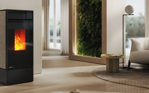 Stufa a pellet moderna con fiamme vive. Scopri come funziona una stufa senza canna fumaria per un riscaldamento efficiente e pulito.